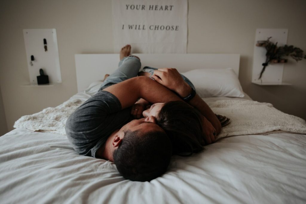 man and woman cuddling