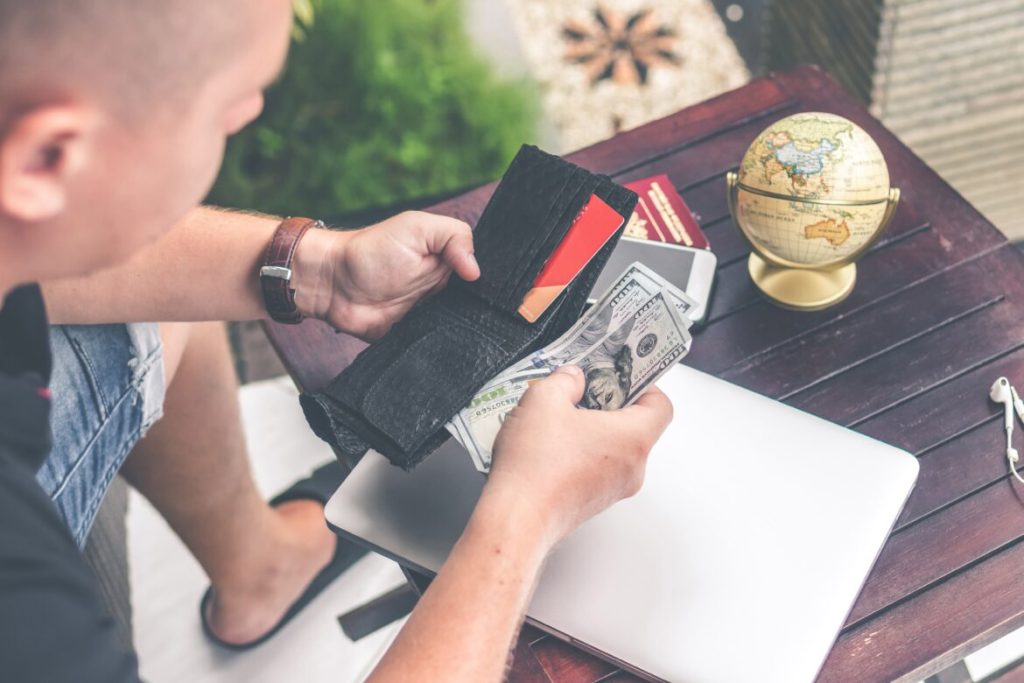 man holding dollar bills
