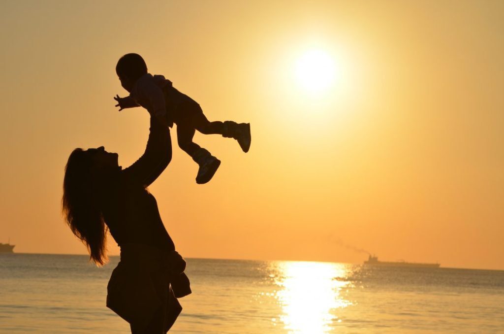 woman carrying baby